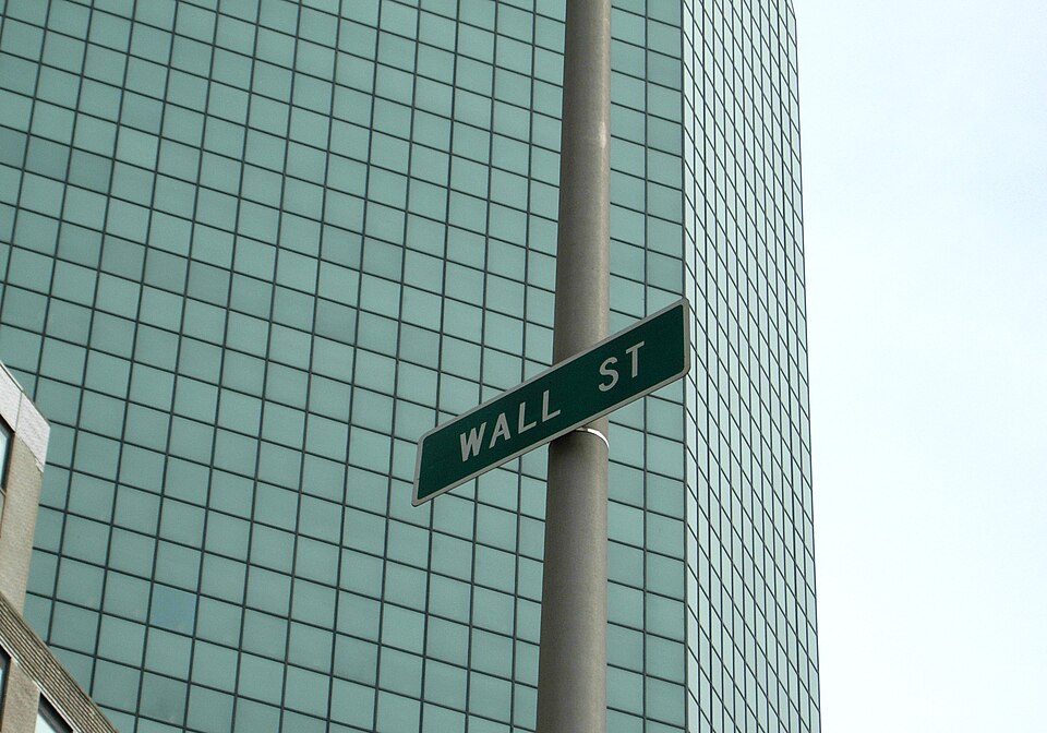 Wall Street sign on the side of a building in New York