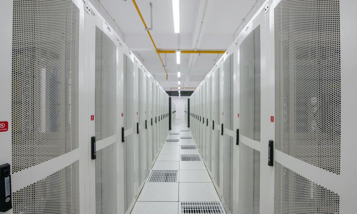 Rows of server racks in a modern data centre