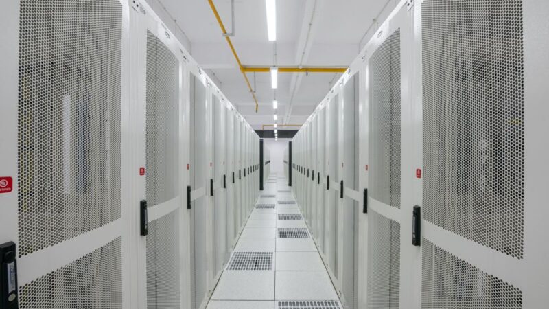 Rows of server racks in a modern data centre