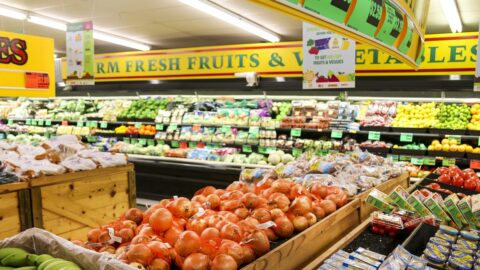 Grocery store aisle with fresh produce