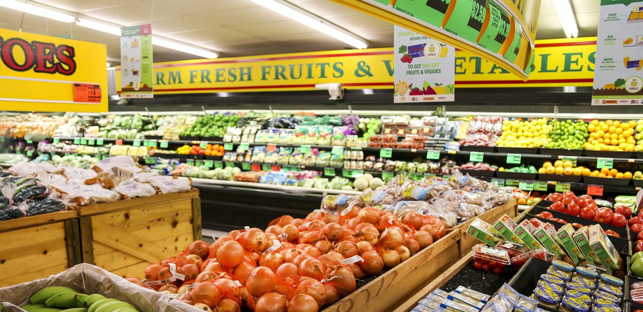 Grocery store aisle with fresh produce