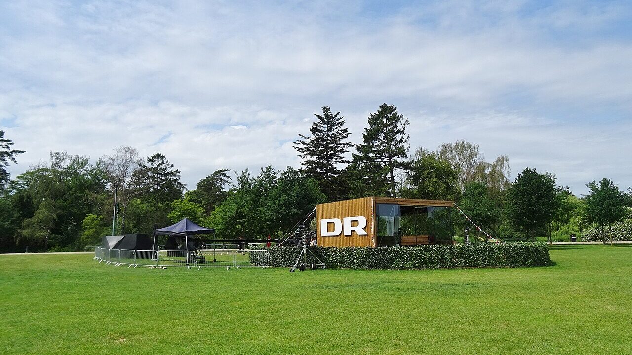Outdoor television broadcast studio with cameras on a grass field